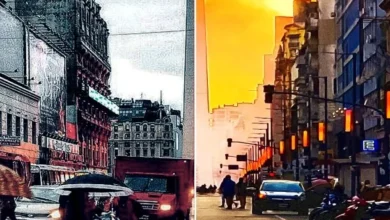 Imagen de un termómetro con una temperatura alta, bajo un cielo parcialmente nublado