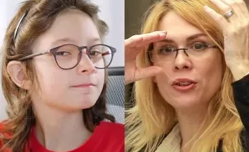 Ian Moche, un niño con autismo, sonriendo y sosteniendo un cartel con el lema 'Respeto para todos'