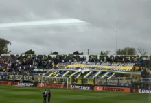 Imagen de los jugadores de Defensa y Justicia y Boca en el campo de juego