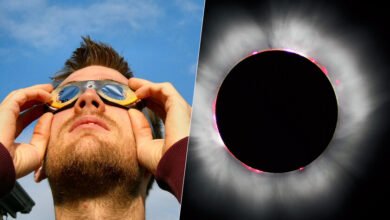 Imagen de un eclipse solar con personas observando con gafas especiales