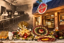 Interior histórico de la panadería La Europea con hornos de fundición y bandejas de pan dulce